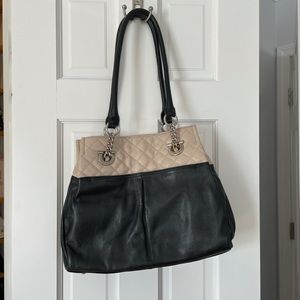 Tignanello bag. Lined with separate compartments.